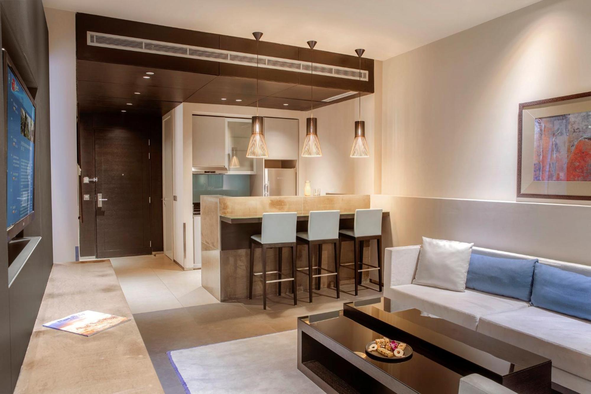 The Abdali Boulevard Hotel Amman Exterior foto A living room with a kitchenette